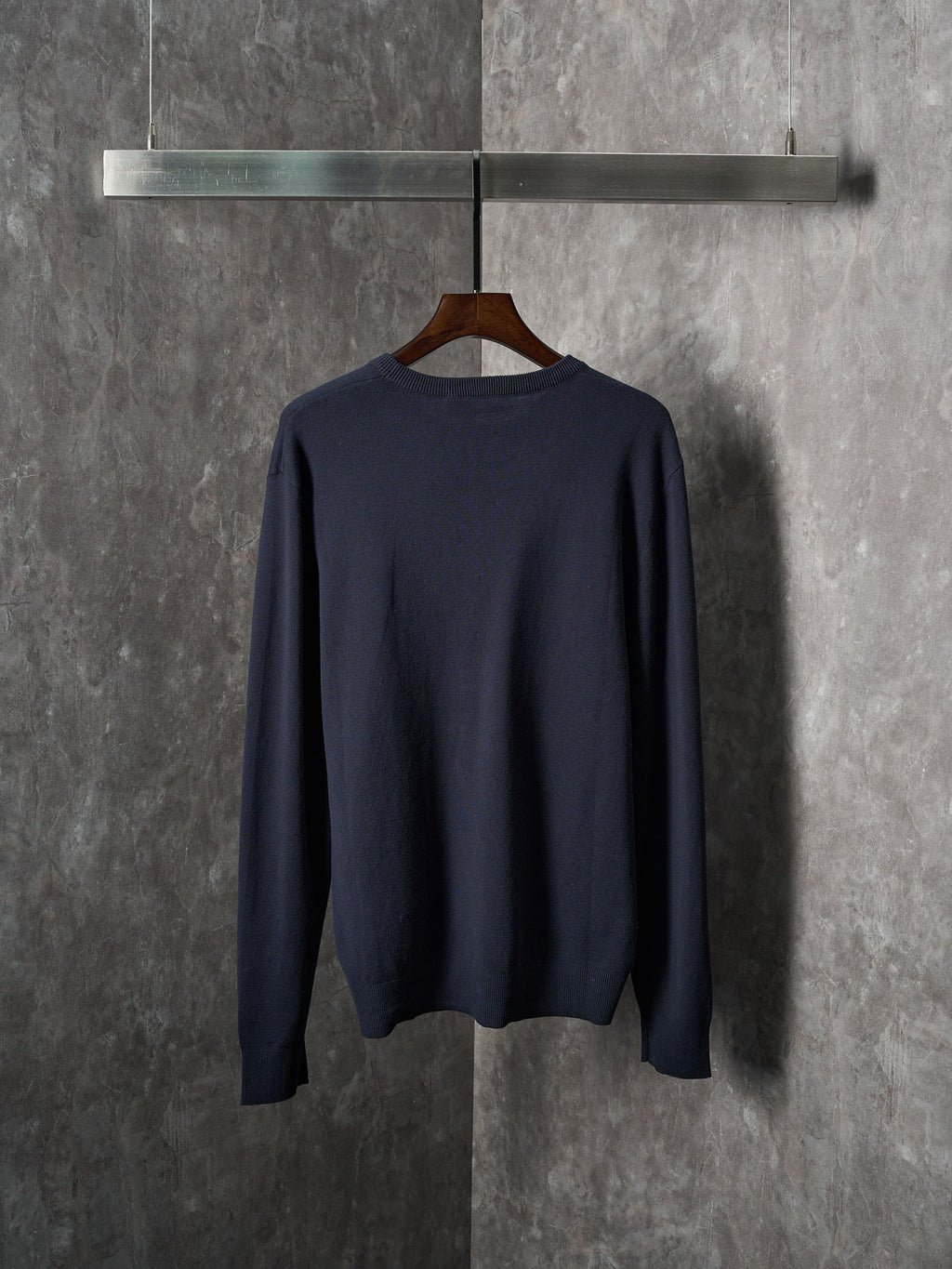 Navy knit long-sleeve sweater back view with ribbed hem and cuffs