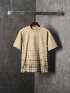 Beige short-sleeve T-shirt with check plaid panel across the lower front