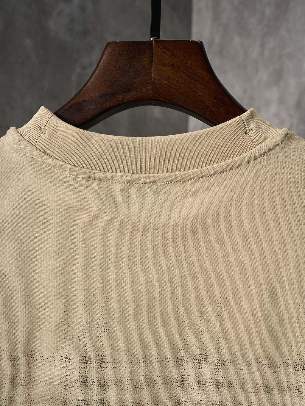 Beige crew-neck short-sleeve T-shirt with check plaid detail near the hem