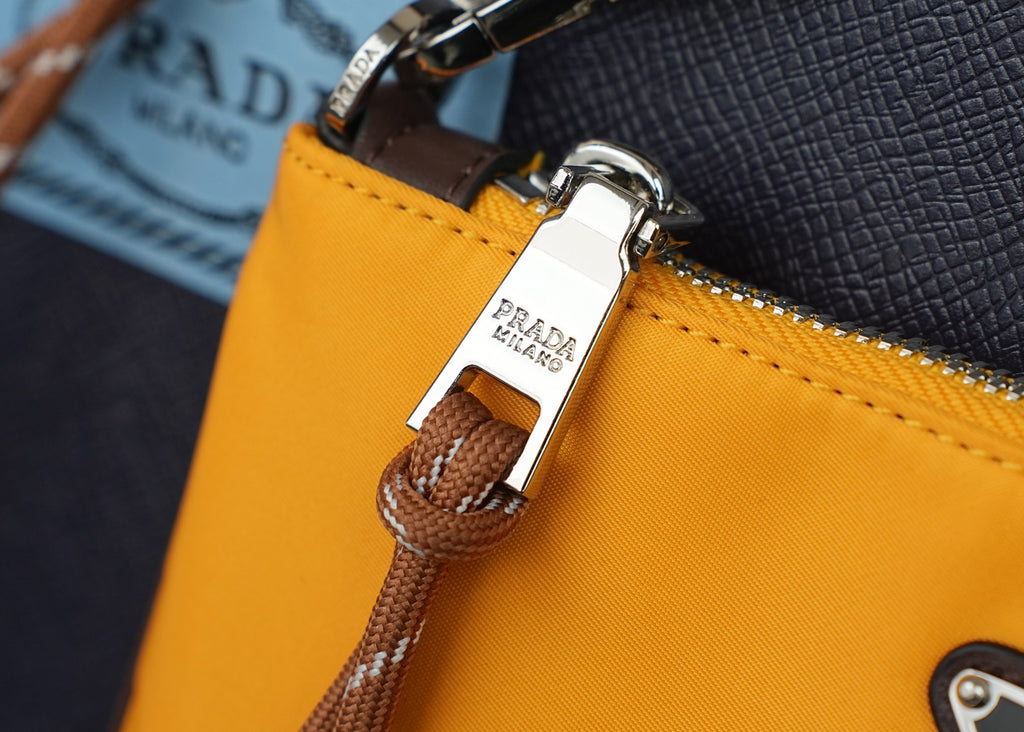 Mustard bag zipper tab with braided pull and leather strap attachment