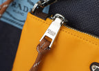 Mustard bag zipper tab with braided pull and leather strap attachment