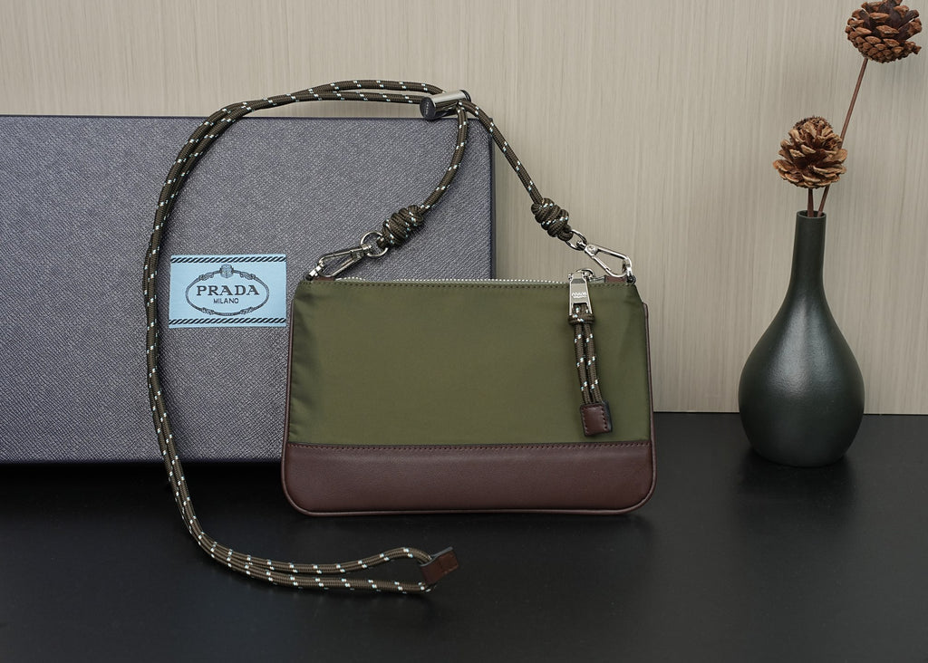 Prada bag side view with olive panel, brown base, and chain strap