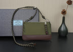 Prada bag side view with olive panel, brown base, and chain strap