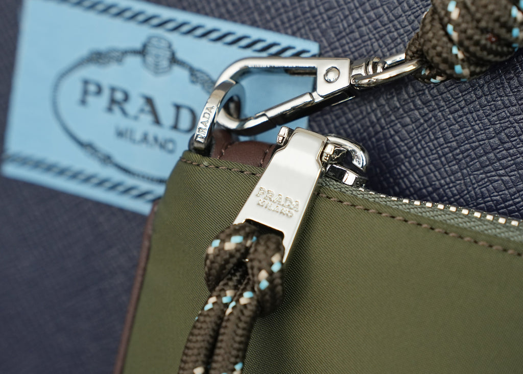 Prada bag clasp and braided chain strap on olive fabric with leather patch