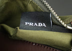 Prada bag close-up of PRADA label inside olive-lined pocket