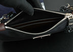 Open Prada bag interior with black lining and silver zipper pull