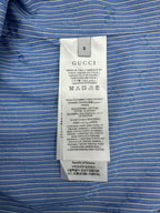 Gucci size and fabric label on blue vertically striped shirt with GG pattern