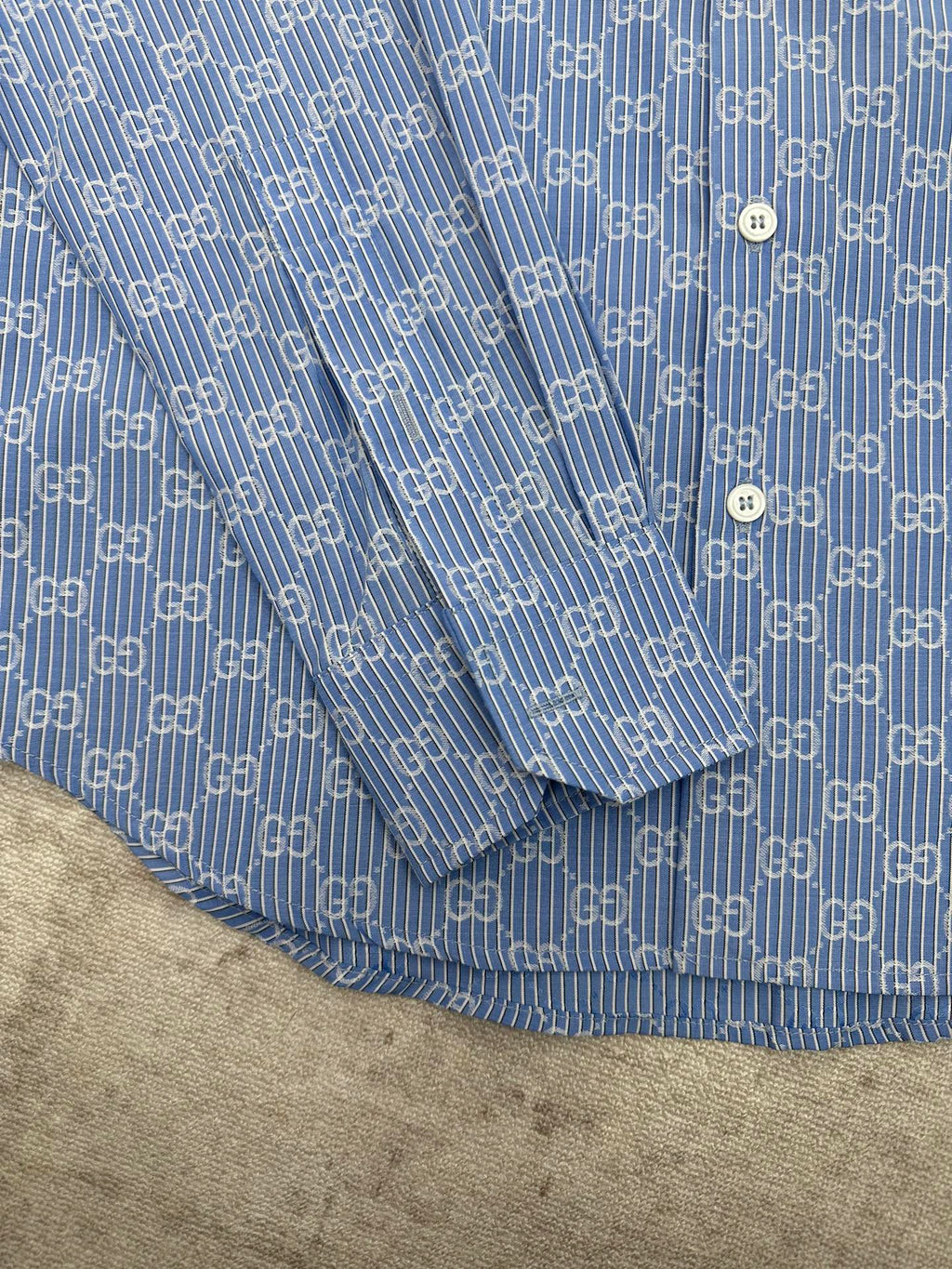 Blue Gucci shirt upper section with allover GG monogram and fine stripe texture