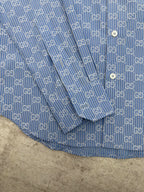 Blue Gucci shirt upper section with allover GG monogram and fine stripe texture