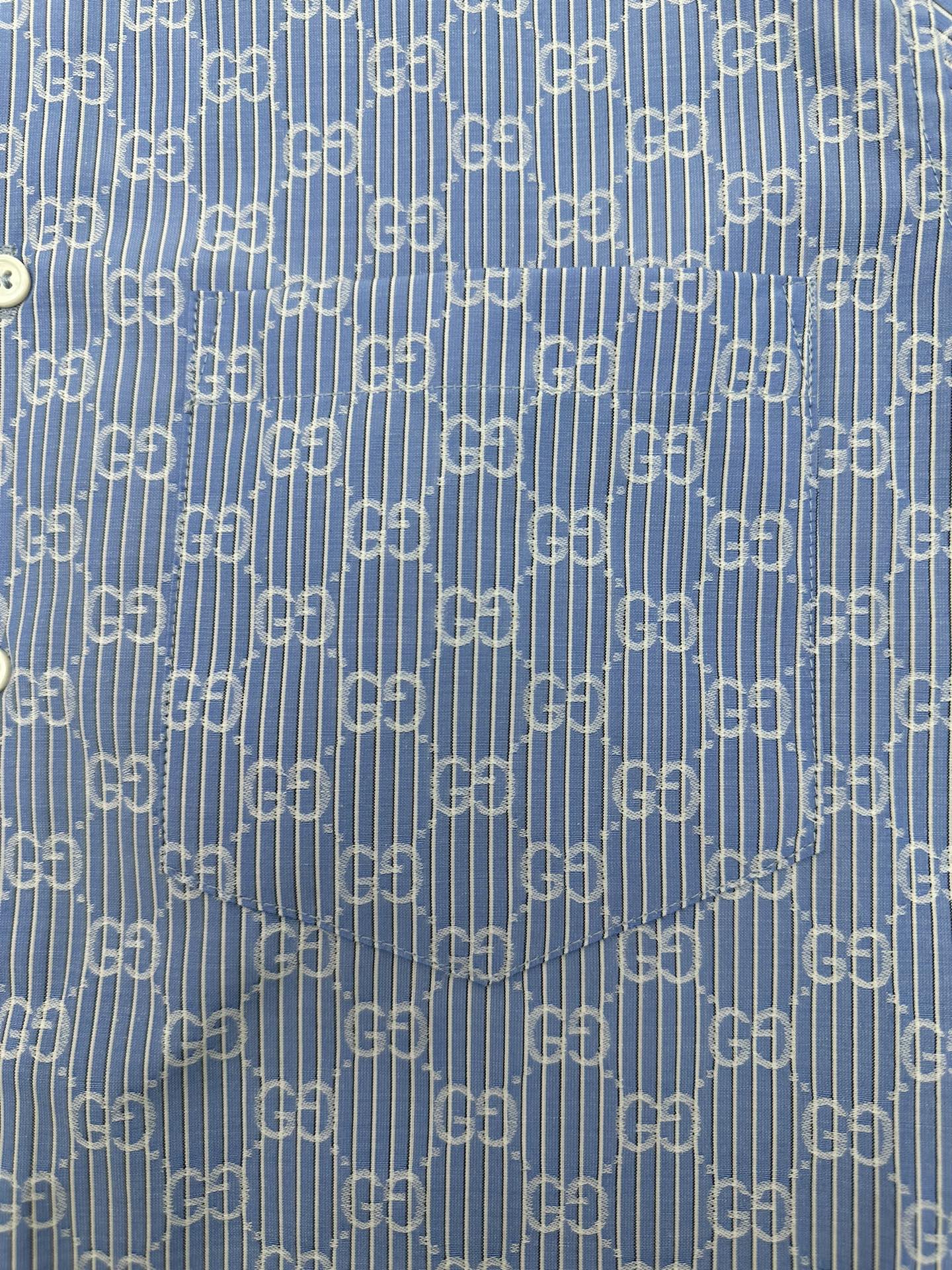 Blue Gucci GG monogram patterned fabric with fine vertical stripes