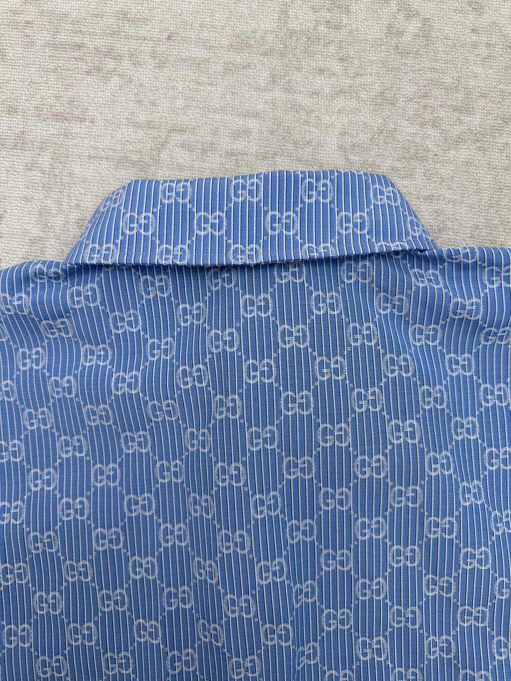 Blue Gucci shirt neckline with GG monogram pattern and button placket