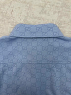 Light blue Gucci button-up shirt back yoke and collar seam with GG monogram