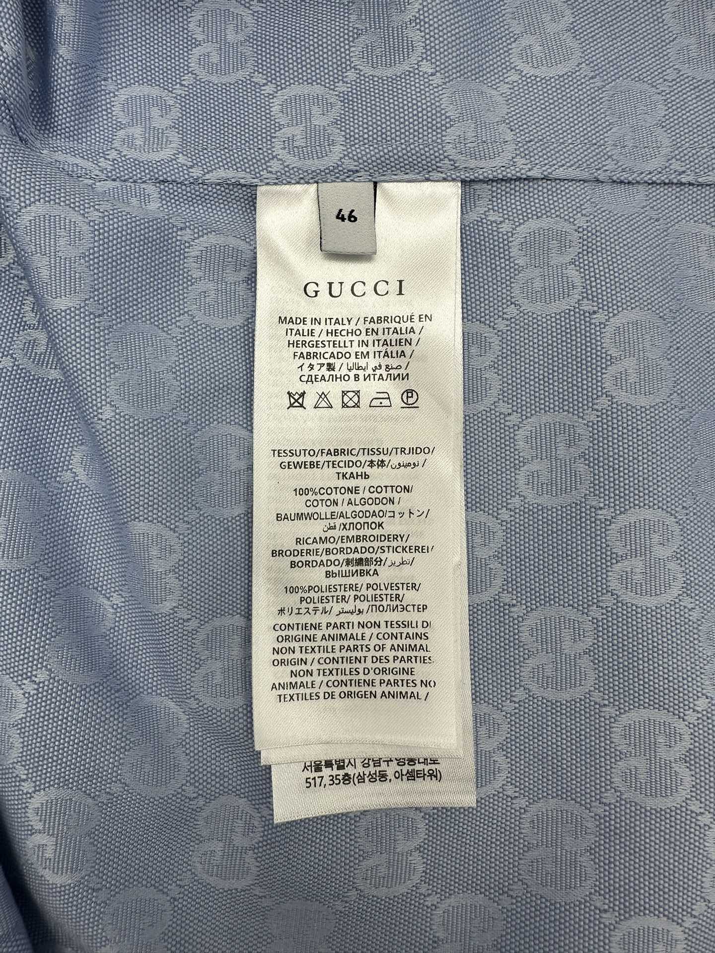 Gucci fabric care label inside light blue shirt, size 46