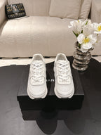 Chanel unisex white lace-up sneakers, side view with padded collar
