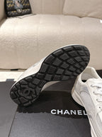 Chanel unisex white sneakers with black treaded rubber outsole