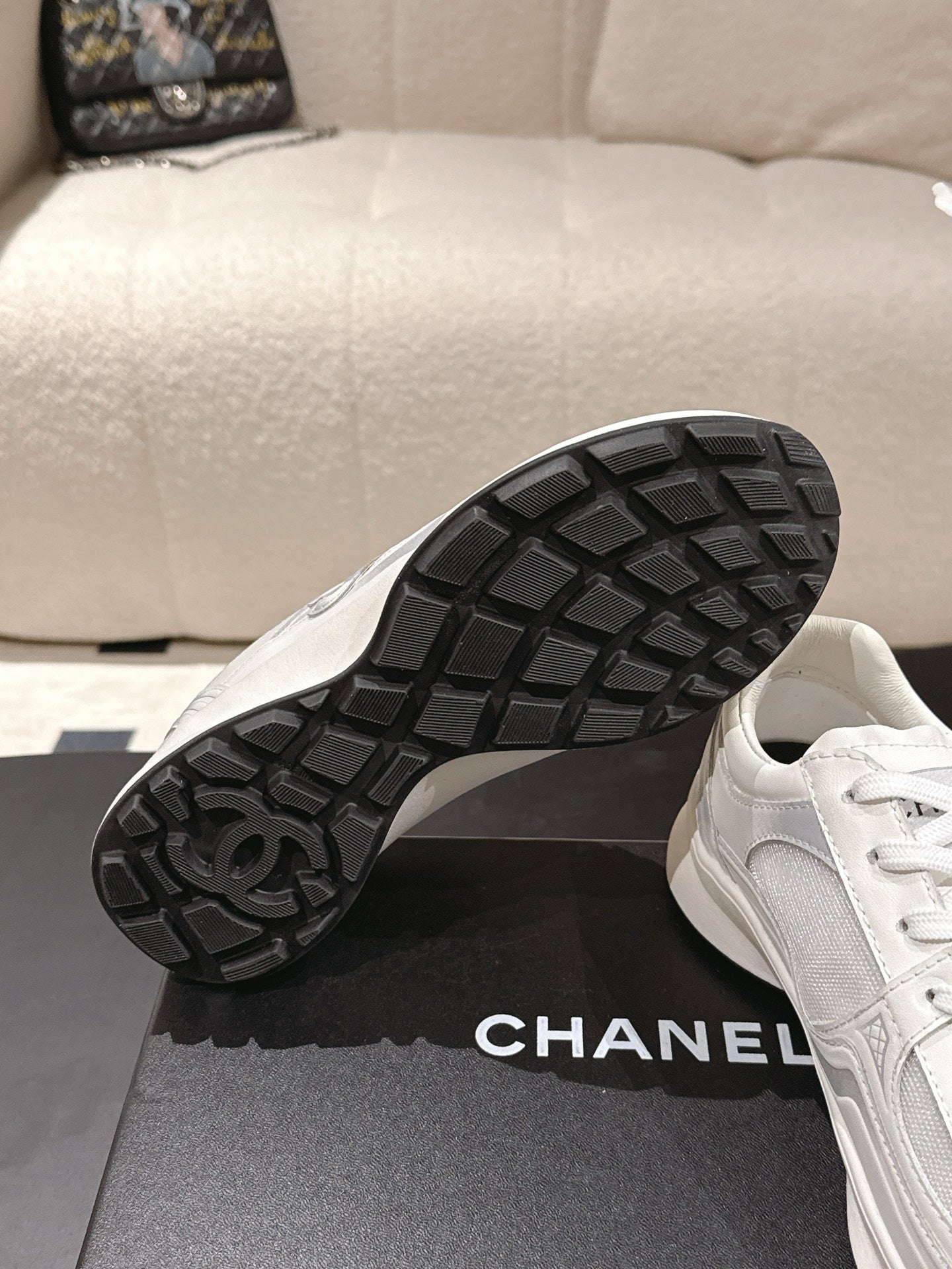 Chanel unisex white sneakers with black treaded rubber outsole