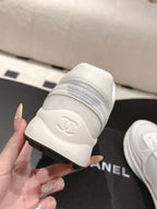 Chanel unisex white sneakers heel with embossed logo and cushioned collar