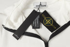 Stone Island quarter-zip fabric close-up with black zipper and branded tags