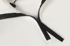 White zip-up hoodie with black zipper and drawstrings