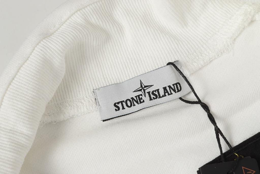 Stone Island neck label inside collar with ribbed white trim and black cord
