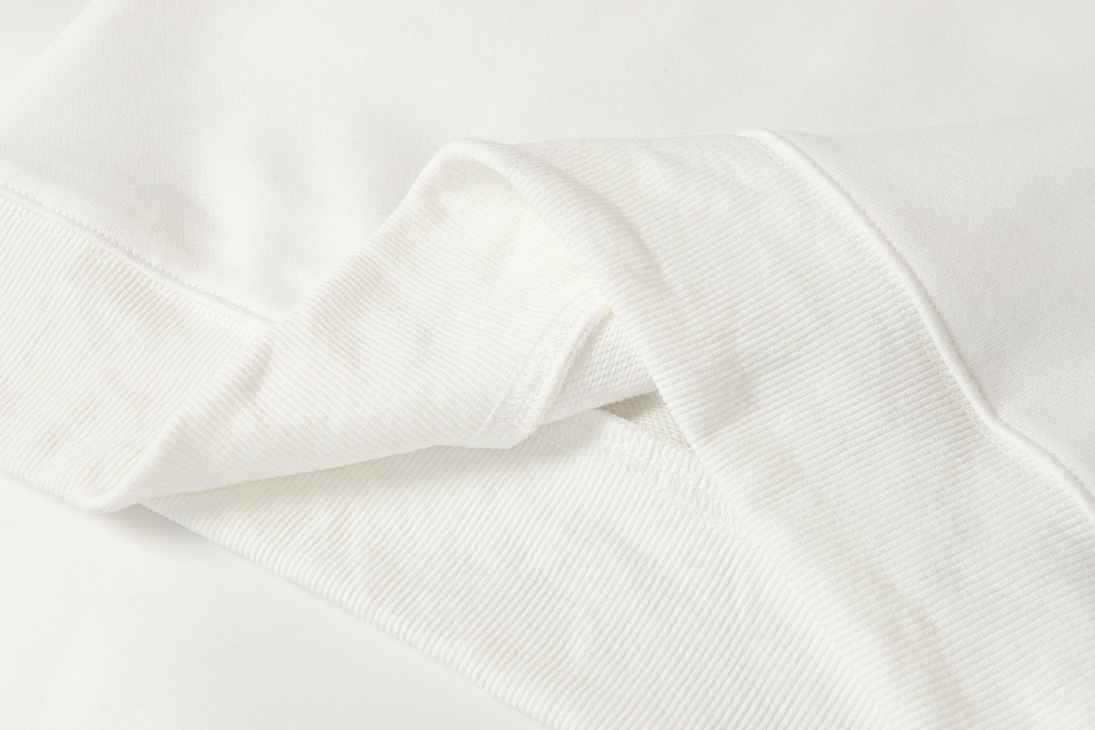 White zip-up hoodie fabric seam and cuff