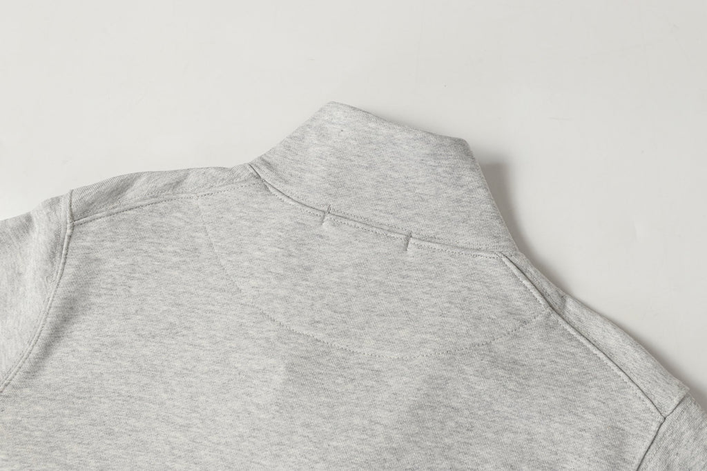 Light gray sweatshirt with high mock neck and small seam detail