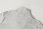 Light gray sweatshirt with high mock neck and small seam detail