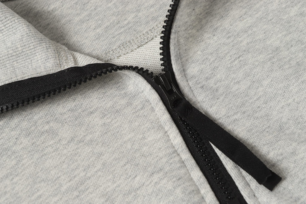 Light gray zip sweatshirt with black zipper and textured edge stitching