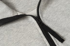 Light gray zip sweatshirt with black zipper and textured edge stitching