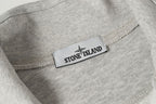 Light gray sweatshirt with ribbed collar and Stone Island logo patch