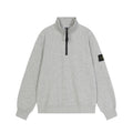 Light gray quarter-zip sweatshirt with black zipper and mock neck