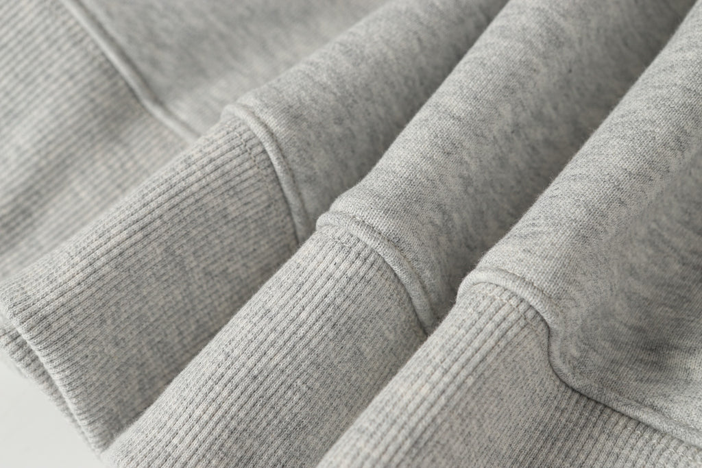Stone Island crewneck sweatshirt in light gray knit with ribbed cuffs and seams