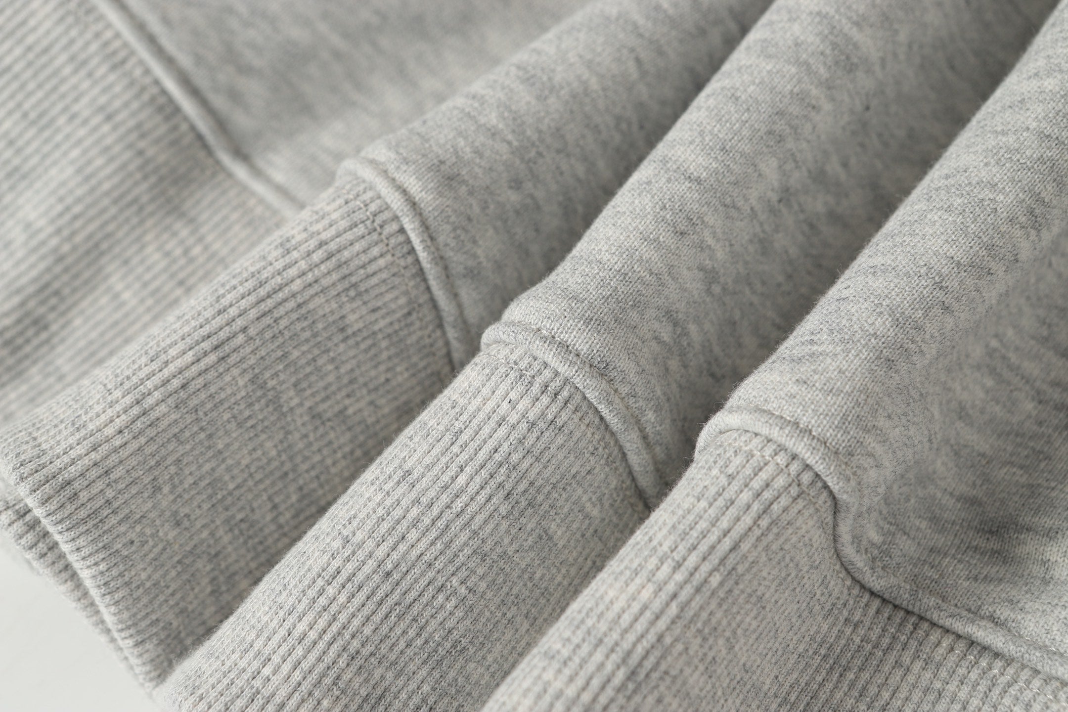 Stone Island crewneck sweatshirt in light gray knit with ribbed cuffs and seams