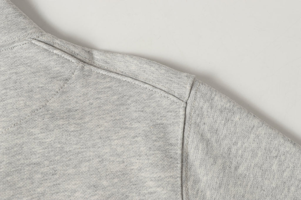 Light gray sweatshirt hem with clean side seam