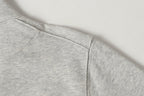 Light gray sweatshirt hem with clean side seam