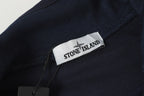 Stone Island logo patch on dark sweatshirt chest