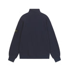 Dark navy quarter-zip sweatshirt with stand collar and logo patch on sleeve.