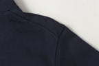 Navy quarter-zip sweatshirt with side seam and clean stitch detailing.