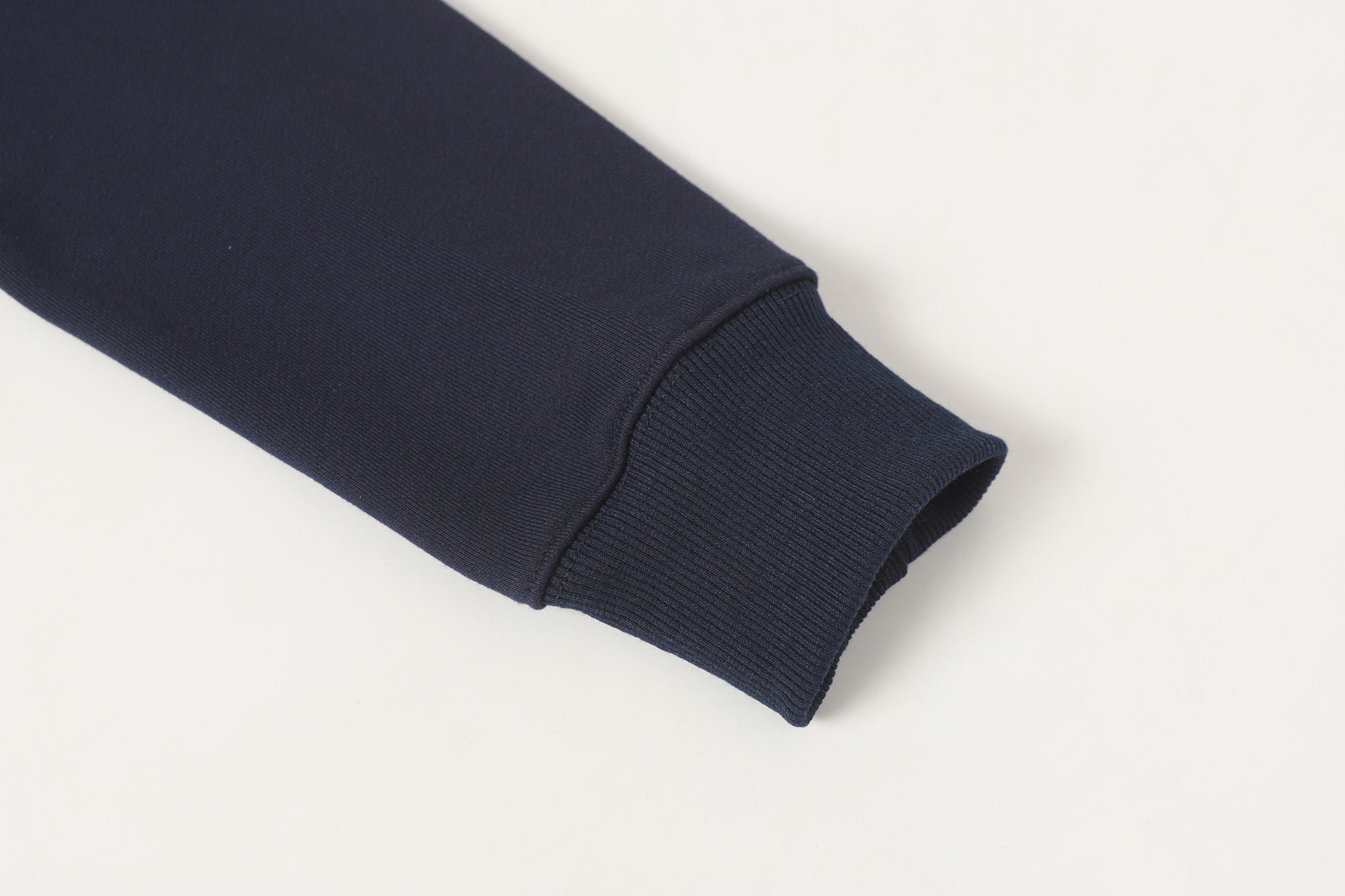 Navy sweatshirt sleeve cuff with ribbed hem