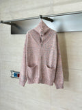 Pink speckled knit cardigan sweater with button front and stand collar, long sleeves
