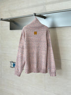 Pink speckled knit cardigan sweater on hanger, with small square logo patch on back