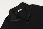Black quarter-zip sweatshirt with neck label and front zipper