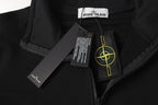 Black quarter-zip top with metal zipper pull, neck label, and care tag