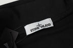 Black sweatshirt with Stone Island logo label at the neckline