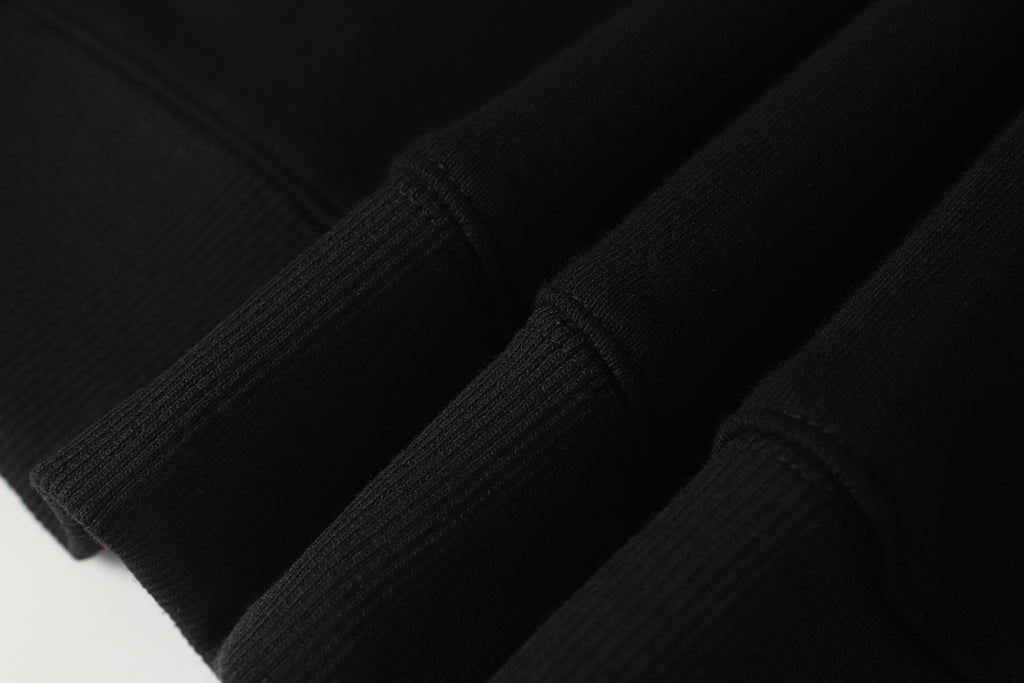 Black ribbed knit sleeve cuff