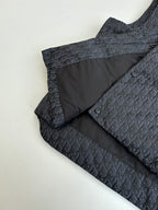 Sleeveless vest interior with dark Dior monogram shell and black lining panel.