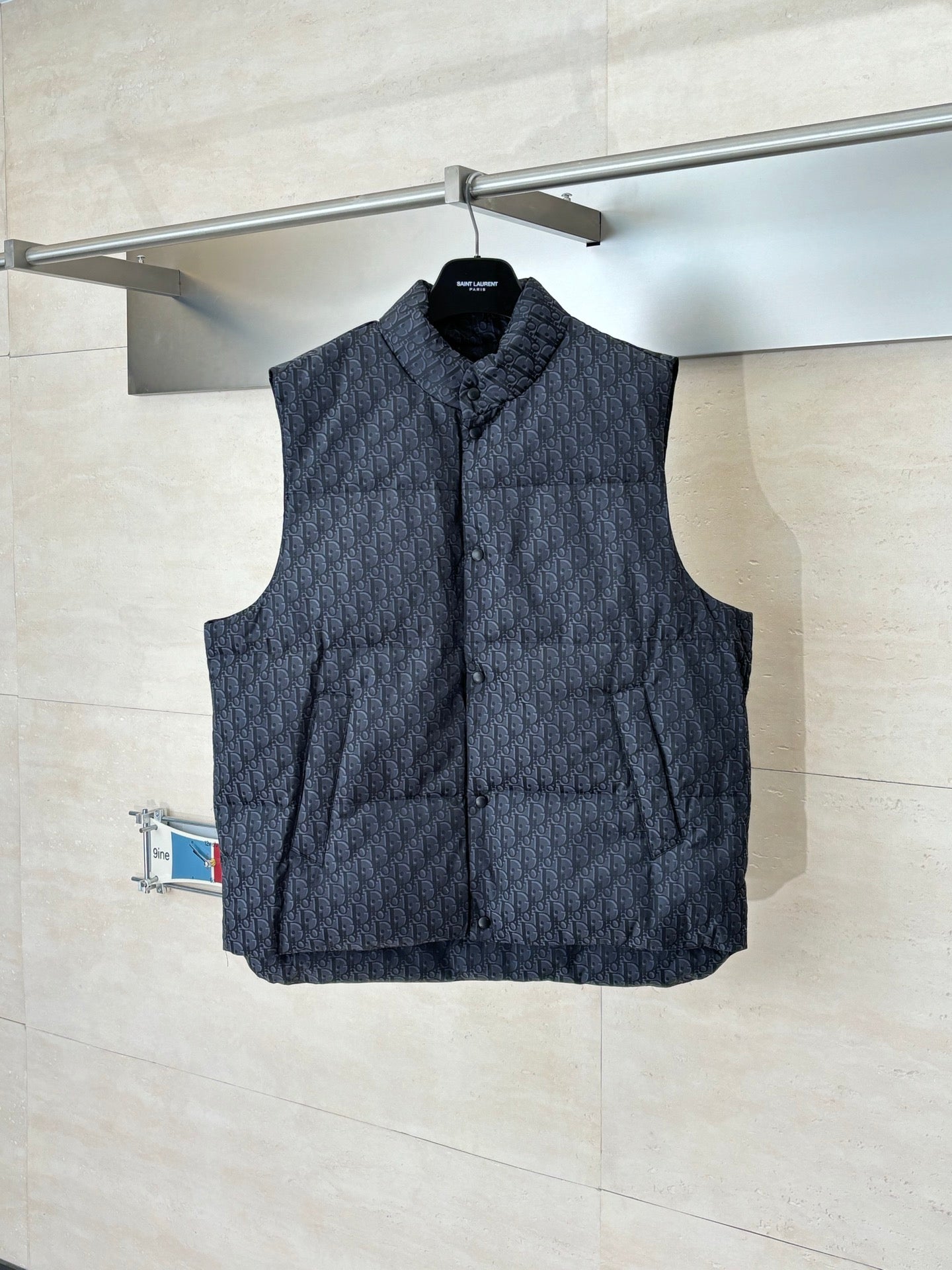 Quilted sleeveless vest with stand collar, dark Dior monogram pattern, button front.