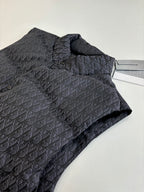 Folded sleeveless quilted vest in dark Dior monogram fabric with stand collar.