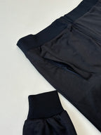 Gucci zip jacket close-up with dark navy drawstring waist and ribbed knit cuffs