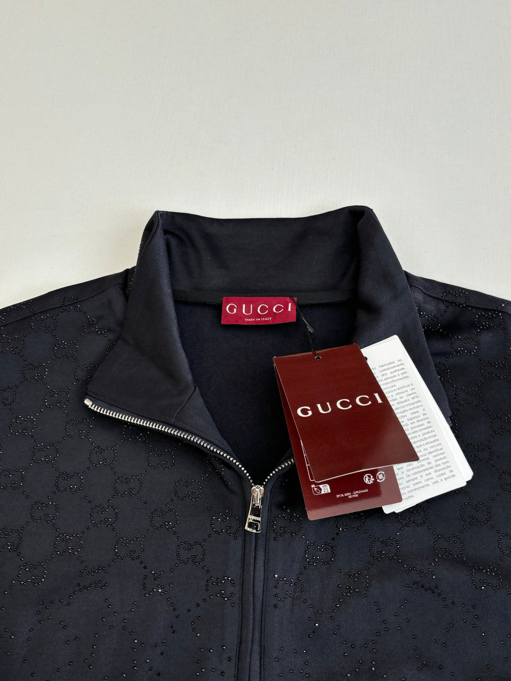 Gucci zip jacket with dark navy monogram, metal zipper, stand collar